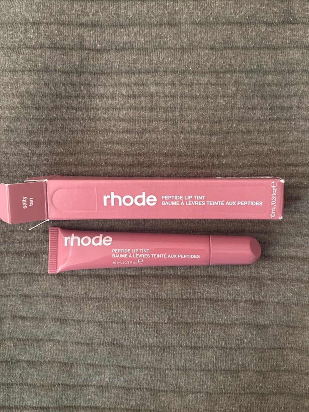 rhode Peptide Lip Tint in shade: “Salty Tan”